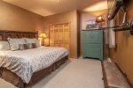 Master Bedroom- King Bed, Flatscreen TV, Dresser, & Closet